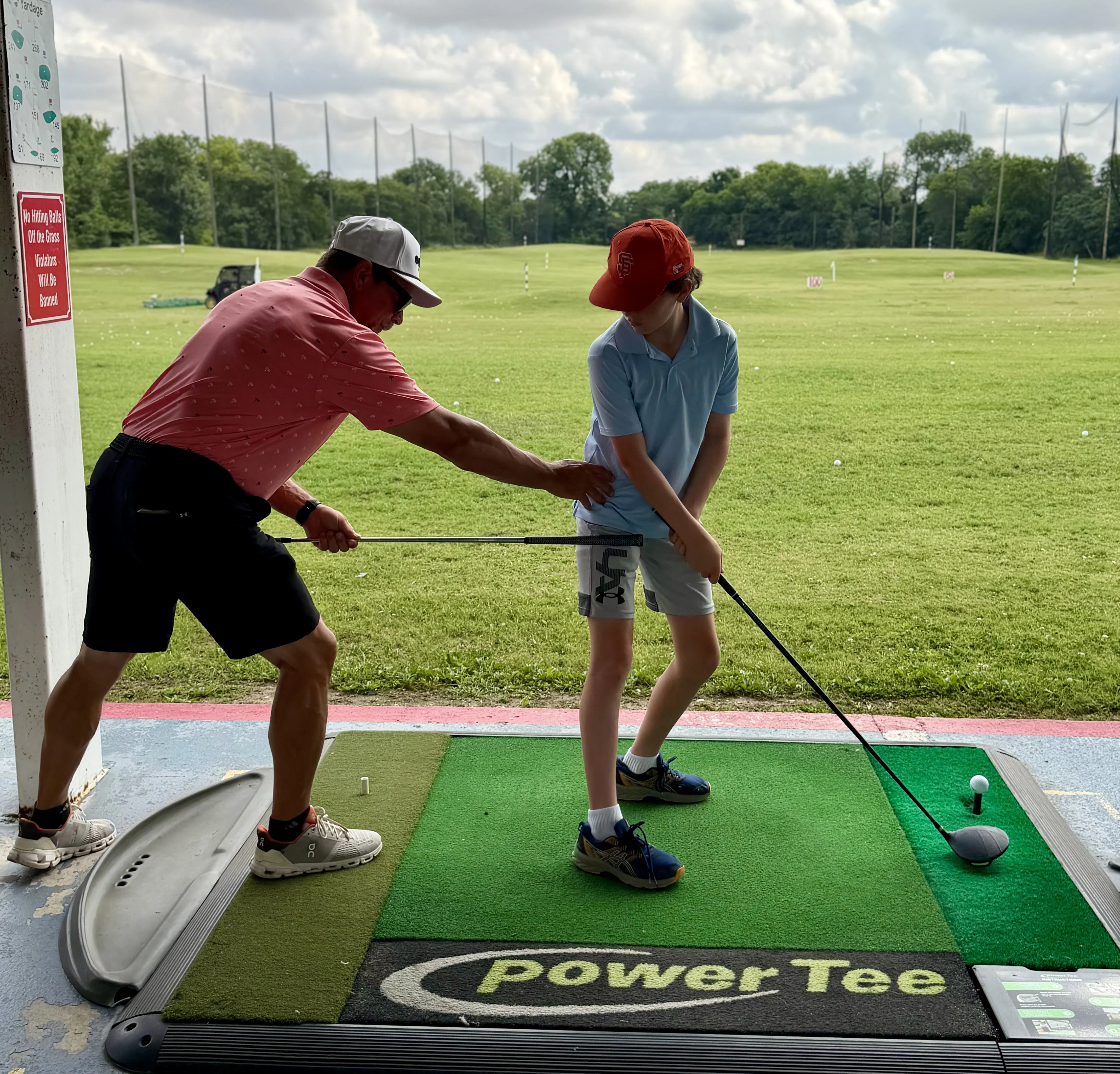 Junior golf lesson on the range at Golf Center of Arlington